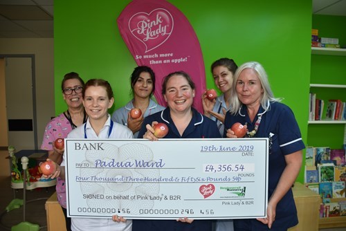 Nurses at cheque presentation